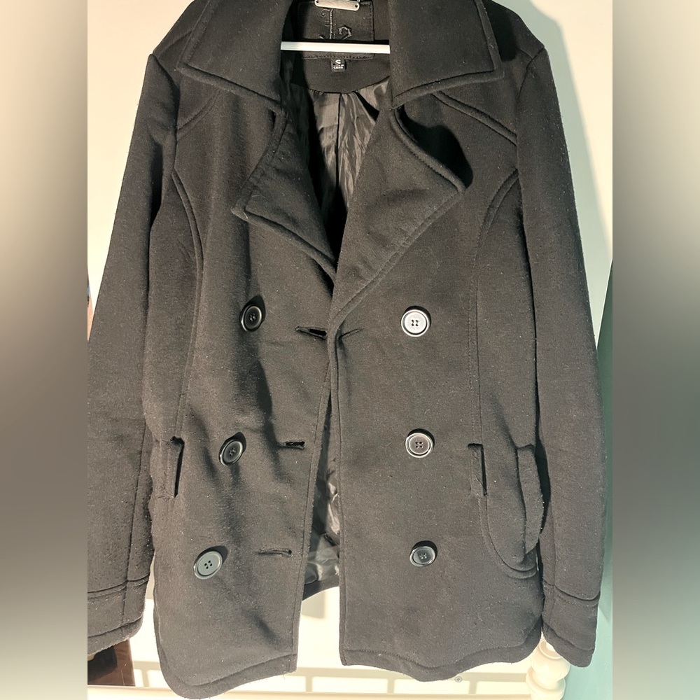 This is a women's black peacoat. Size small. Super conventional for formal wear!